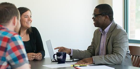 Drake Law professor meeting with students